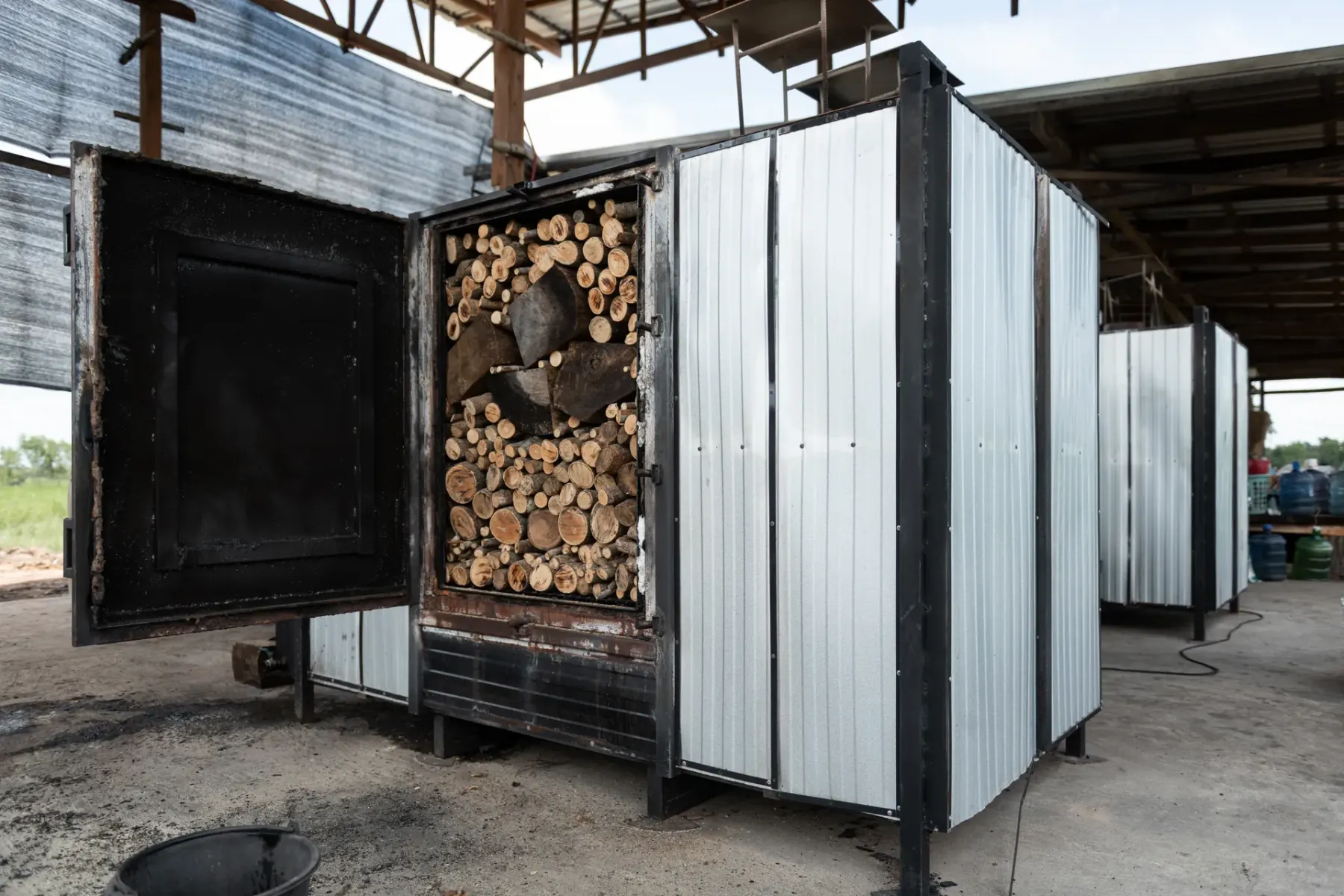 Row of steel carbonization kilns under the factory roof