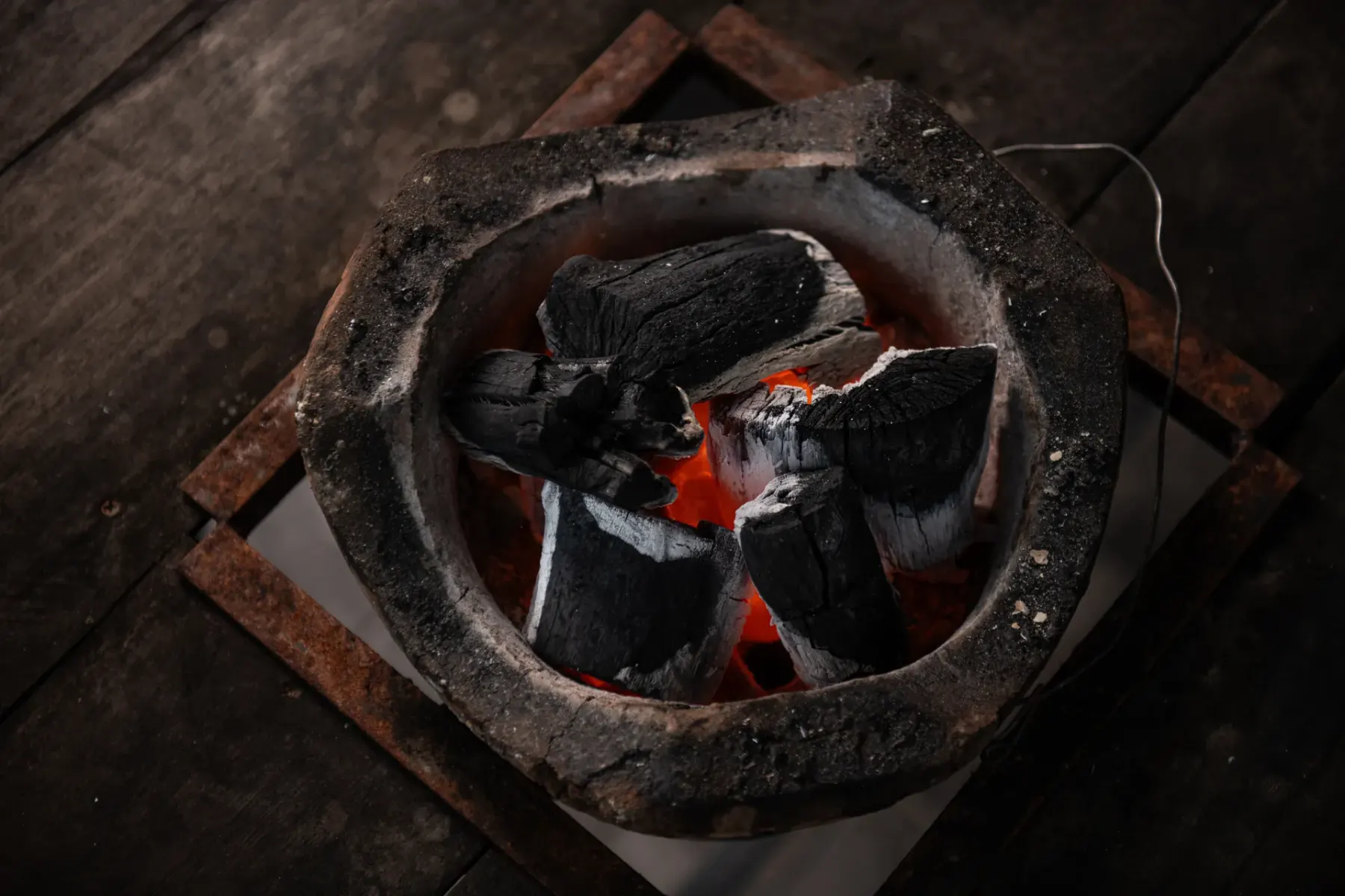 Burn test: charcoal glowing evenly in a stove