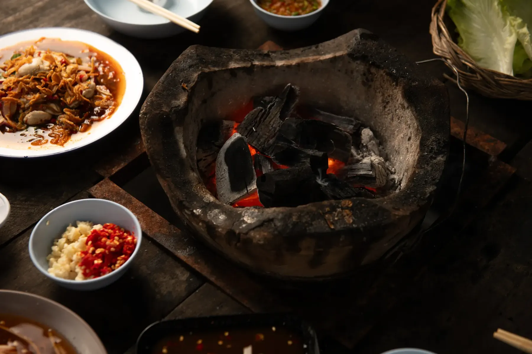 Glowing coals in a clay stove